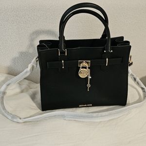 Authentic Michael Kors Hamilton bag and wallet new without tags.
